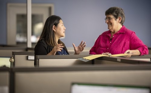 Two staff members at the Marcus Institute for Aging Research in Boston in a discussion